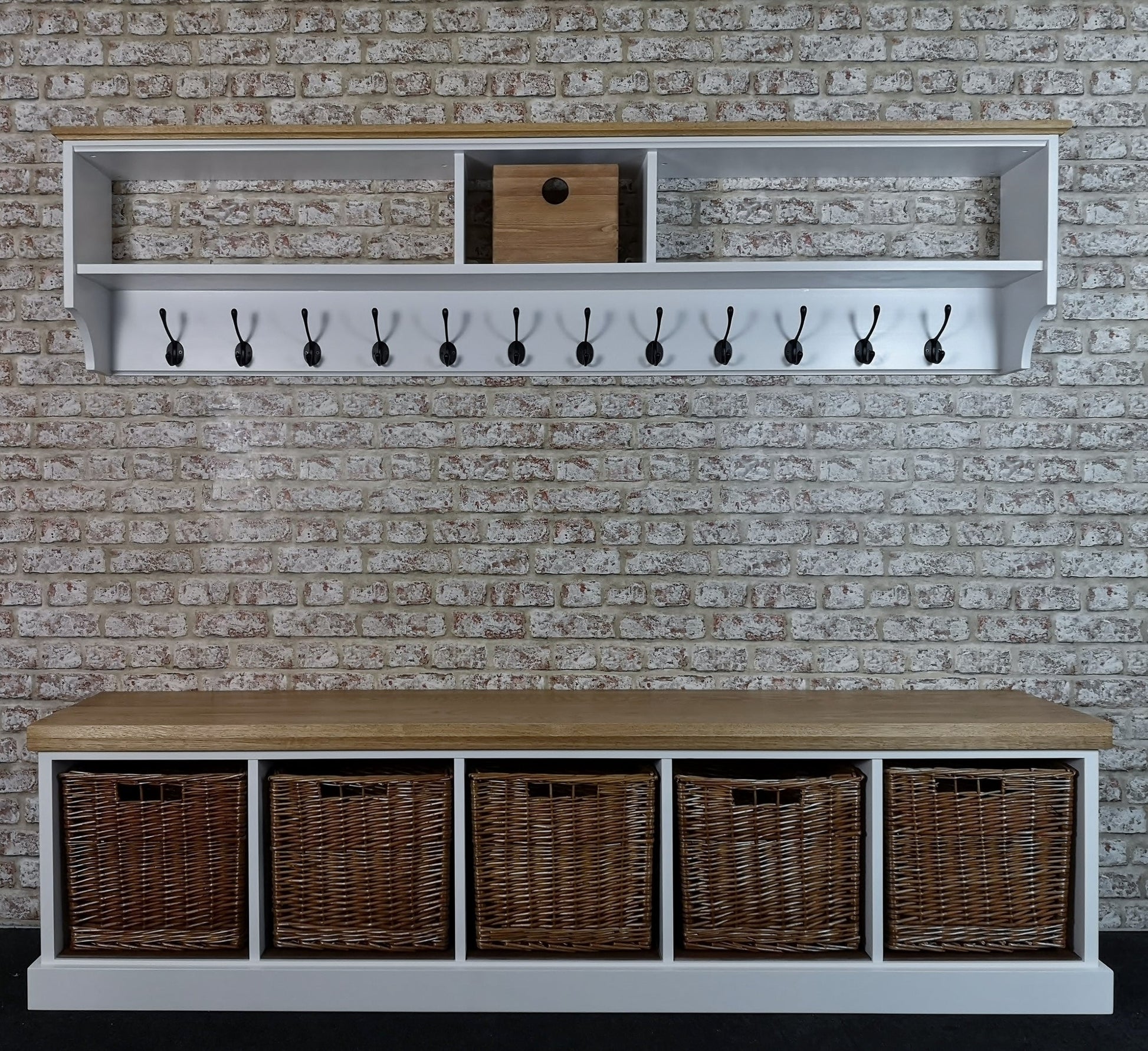 Hallway set painted white with antique pine tops. Comprising of a coat rack with black hooks to hang coats. A shoe bench with 5 wicker baskets large enough to store shoes