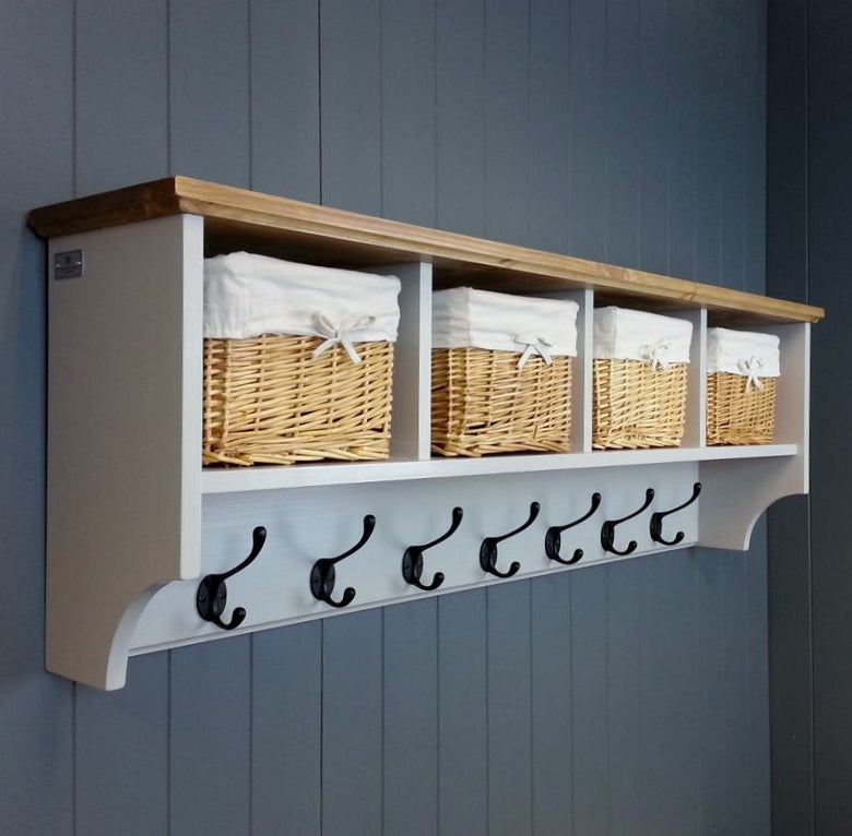A handmade hallway coat rack or nursery furniture with wicker storage baskets. Painted french grey with an antique pine top and black hooks.