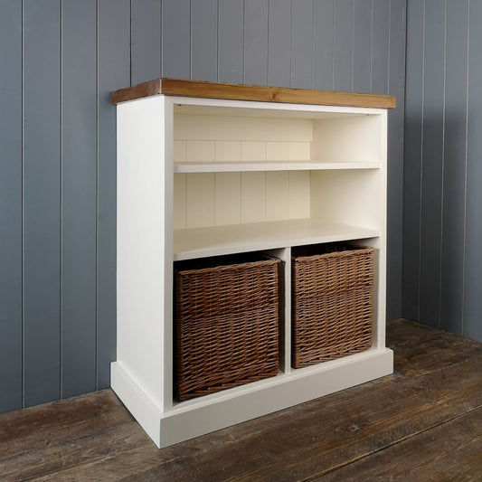 Large hallway storage with two shelves and two large wicker baskets. Painted antique white with an antique pine top