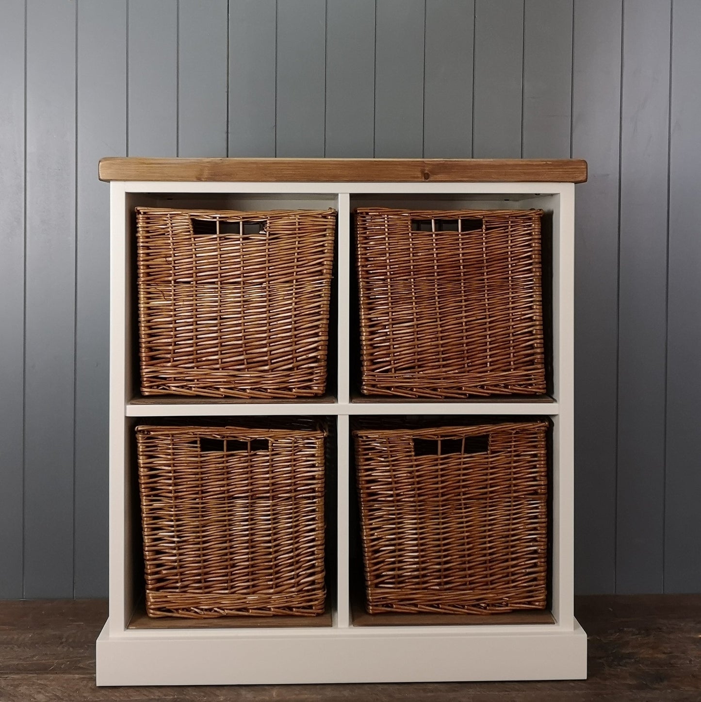 Large antique white painted hallway or nursery storage. 4 large wicker storage baskets suitable for shoes or toys. Antique pine wooden top.