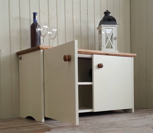 Painted shoe storage cupboard. Door open to show two shelves inside. 