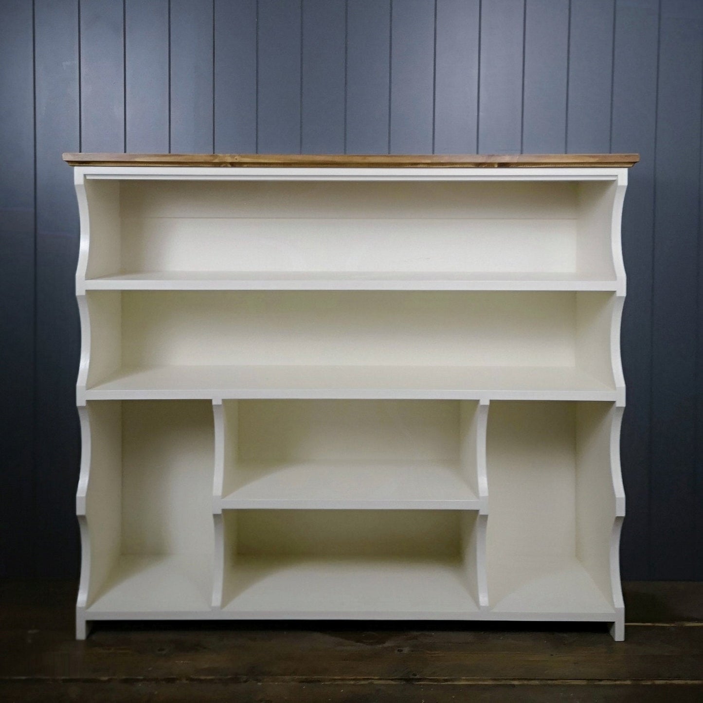 Painted in antique white with an antique pine top. Shoe and boot rack. two long shelves, two small shelves with a space for boots on either side.