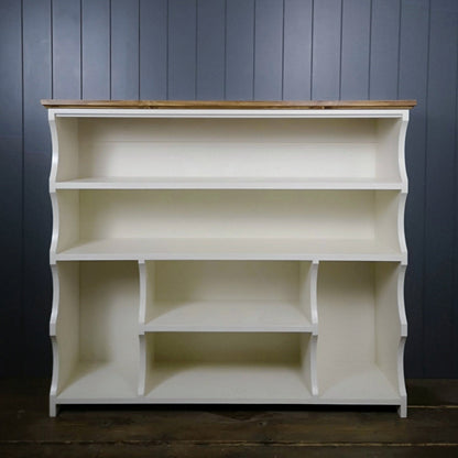 Painted in antique white with an antique pine top. Shoe and boot rack. two long shelves, two small shelves with a space for boots on either side.