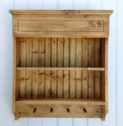 Hand made antique pine spice rack with adjustable shelf and 4 mug pegs.